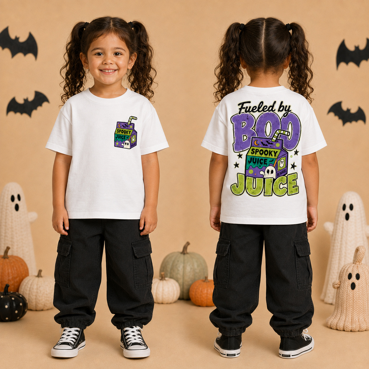 A young girl with curly brown hair in pigtails is shown from the front and back wearing a white graphic t-shirt and black cargo pants. The background is a warm beige color decorated with Halloween elements including pumpkins, ghost decorations, and bat silhouettes.